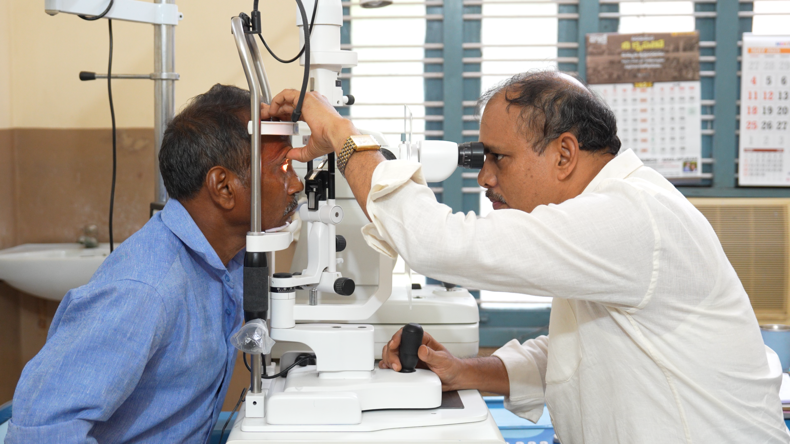 Hand in Hand volunteers and medical staff at a free eye surgery camp in rural India, serving patients who have no other access to care