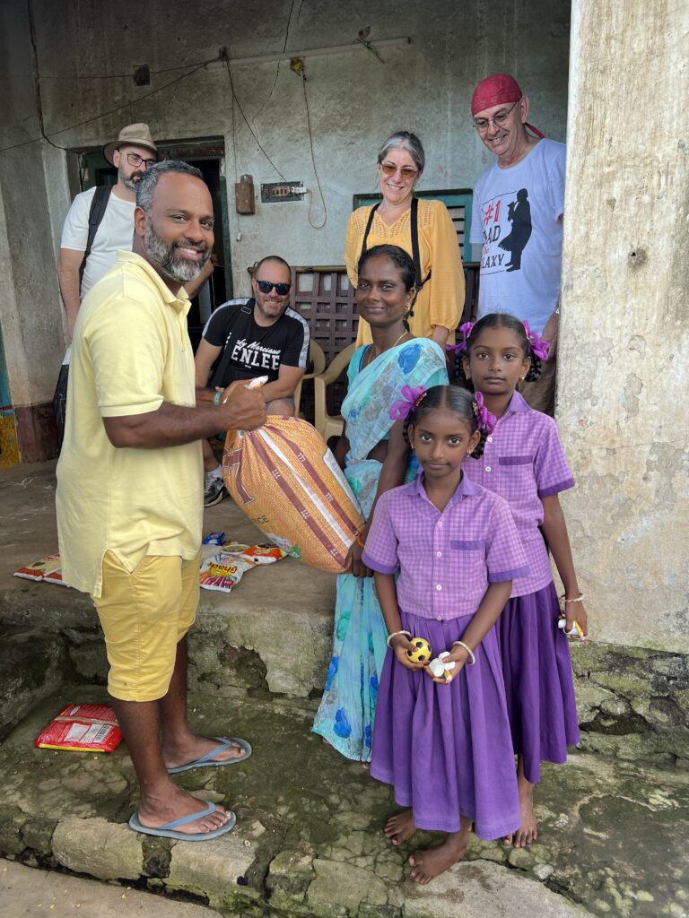 Hand in Hand humanitarian trip team meeting a family in India